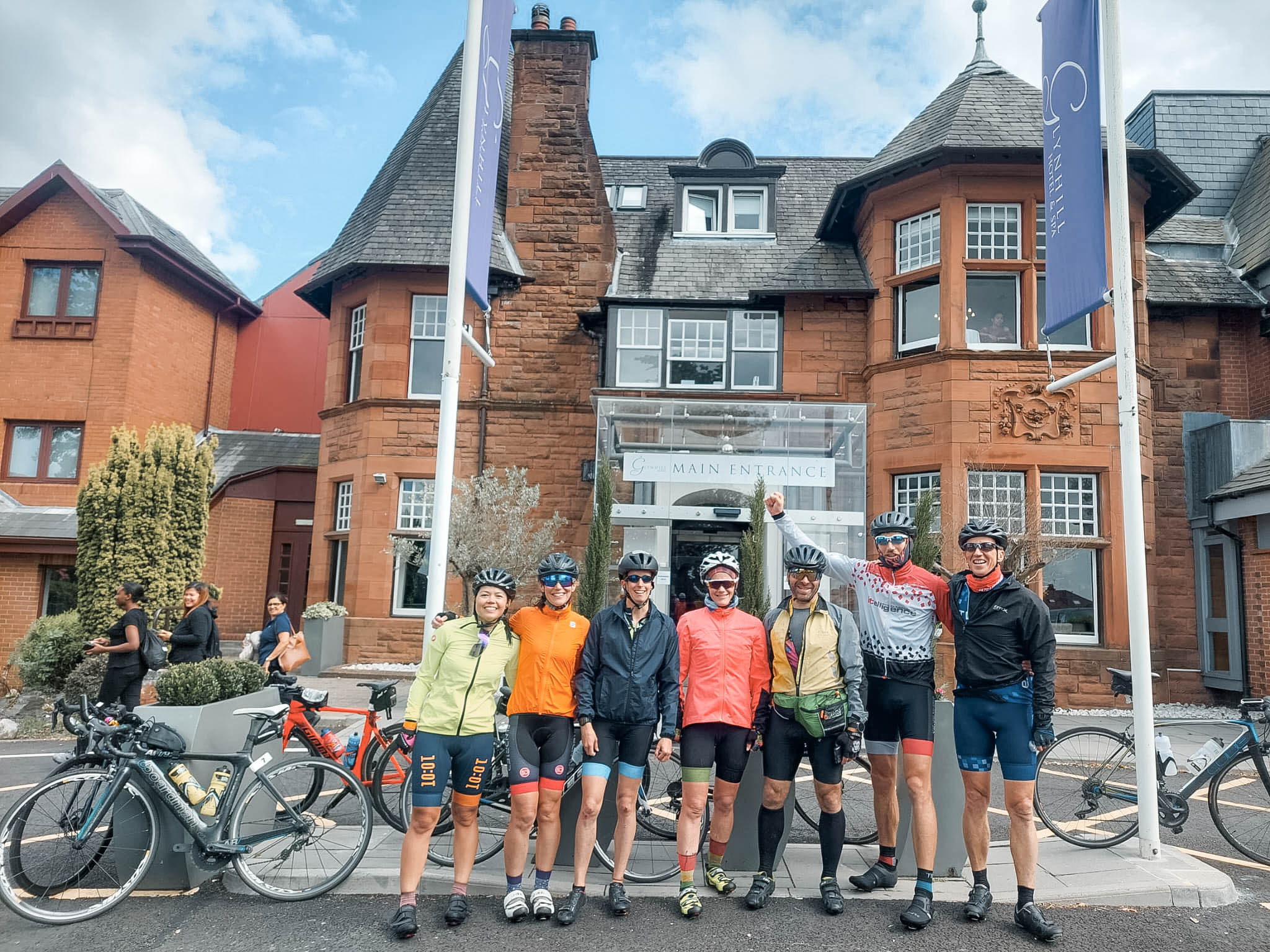 Seven Monster Triathlon cyclists outside their hotel
