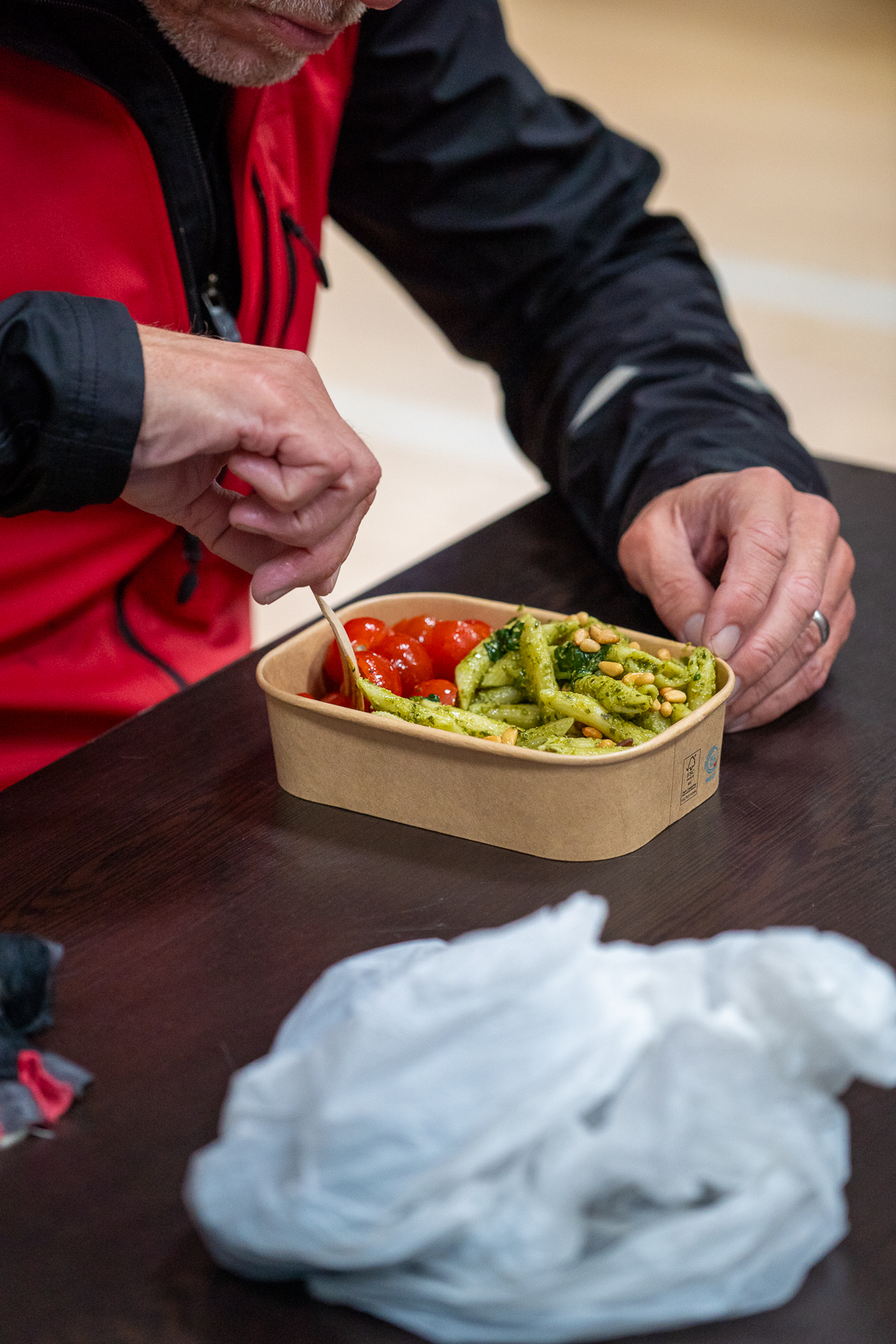 A Monster Triathlon participant eating a pasta and tomato meal