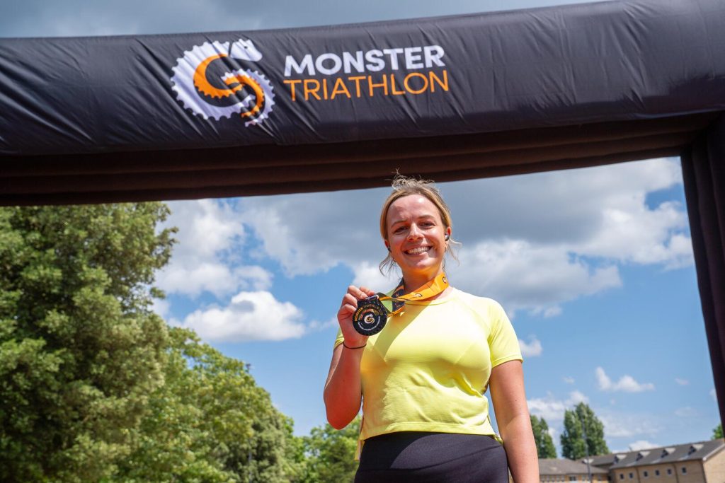 A finisher with her medal