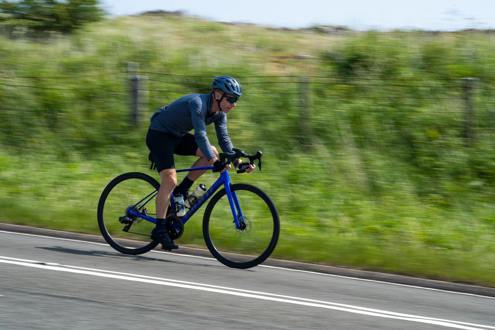 A rider on the longest day through open country