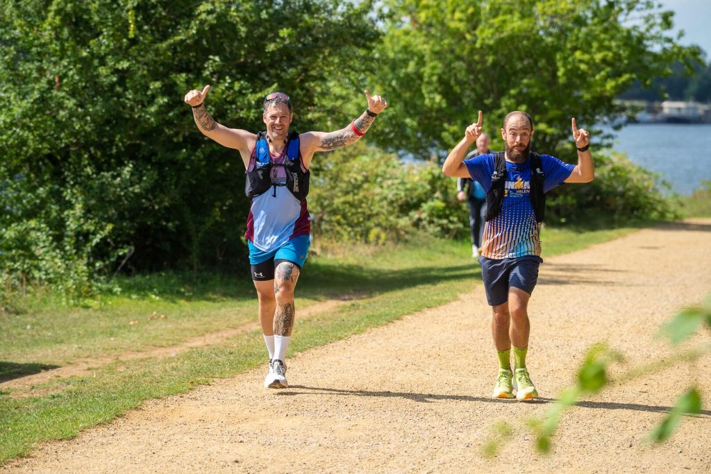 Two participants running the final 50km